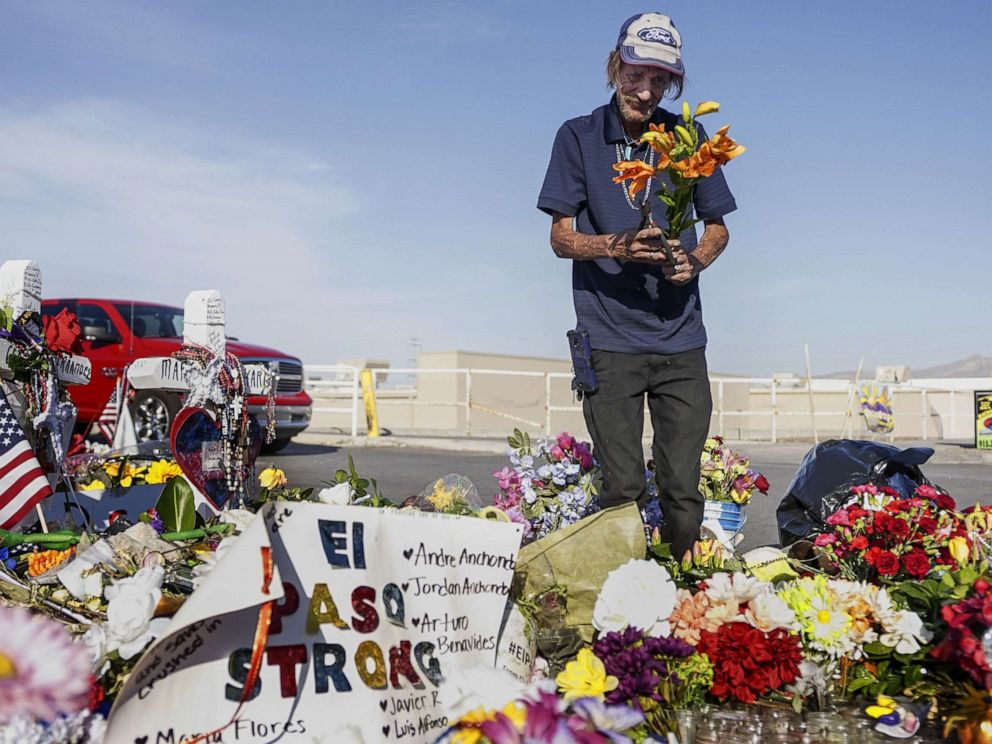 PHOTO: Antonio Basco, whos wife Margie Reckard was one of 22 persons killed by a gunman at a local Walmart, lays flowers in her honor at a makeshift memorial near the scene on August 16, 2019 in El Paso, Texas.