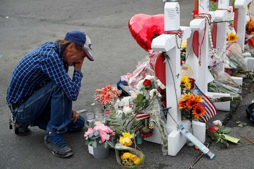 PHOTO: In this Aug. 6, 2019 file photo, Antonio Basco cries beside a cross at a makeshift memorial near the scene of a mass shooting at a shopping complex, in El Paso, Texas.