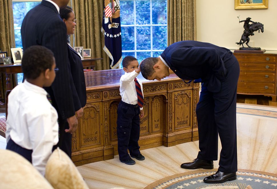 When a 5-year-old visiting the Oval Office in 2009 asked if he could touch President Barack Obama's hair to see if it felt th