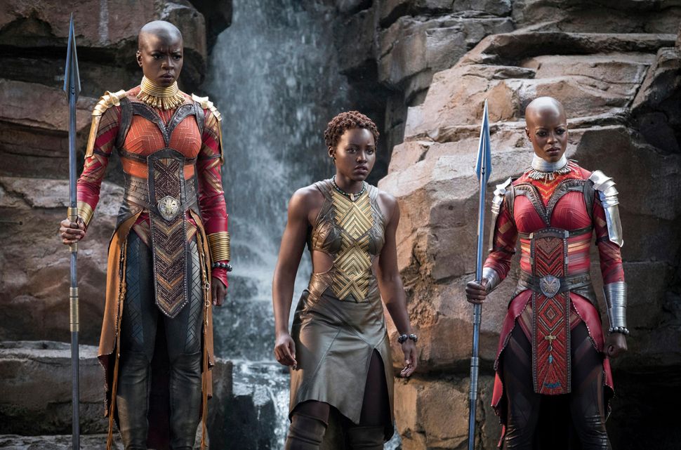 Next to Nyong'o flanked by Danai Gurira, left, and Florence Kasumba in "Black Panther."