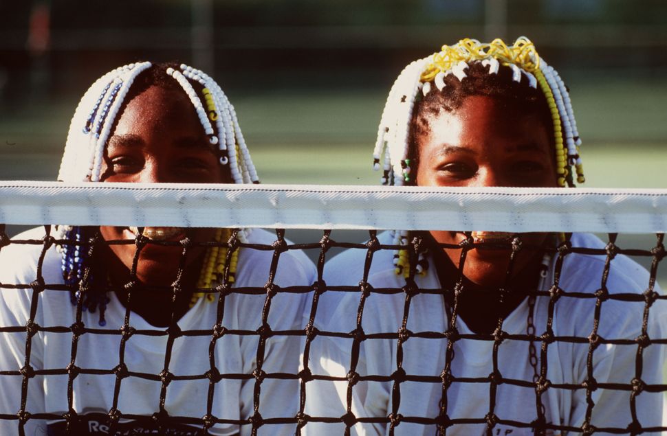 Teenagers Venus (left) and Serena Williams pose together during the Adidas International event in Sydney, Australia, on Jan. 