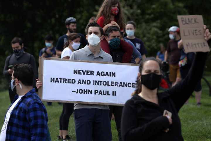 Demonstrators stage a protest near the Saint John Paul II National Shrine, which President Donald Trump visited on June 2 in 