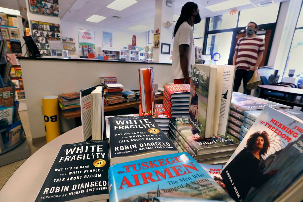 Books including "The Tuskegee Airmen" and "White Fragility" on display in June at the Black-owned Frugal Bookstore in Boston.