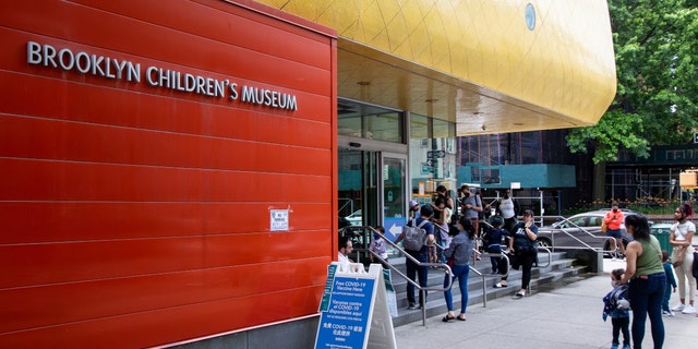Children wait in line to receive a Covid-19 vaccine at the Brooklyn Children's Museum vaccination site, serving children six months to 5-years old, in the Brooklyn borough of New York, on Thursday, June 23, 2022. 