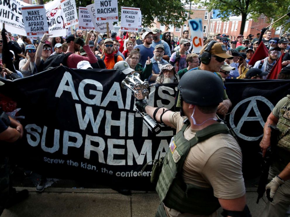 PHOTO: Members of white nationalists are met by a group of counter-protesters in Charlottesville, Va., Aug. 12, 2017. 