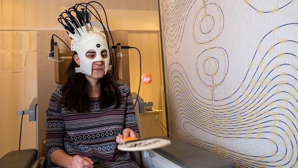 A woman is seen wearing a lightweight and highly sensitive brain imaging device in this undated handout photograph supplied by Wellcome and released in London, Britain March 22, 2018.  Wellcome/Handout via REUTERS  ATTENTION EDITORS - THIS IMAGE HAS BEEN SUPPLIED BY A THIRD PARTY. NO RESALES. NO ARCHIVES. - RC18B5D42180