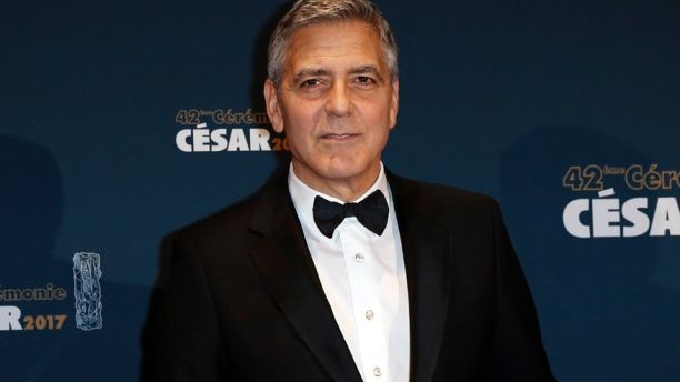 Actor George Clooney holds his trophy during a photocall after receiving an Honorary Cesar Award at the 42nd Cesar Awards ceremony in Paris, France, February 24, 2017. 