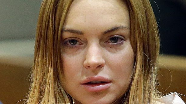 Actress Lindsay Lohan sits at a hearing in Los Angeles Superior Court in Los Angeles, California March 18, 2013. The troubled actress was ordered to spend 90 days in a locked rehabilitation facility and undertake 30 days community labor as part of a plea bargain with prosecutors over charges arising from a June 2012 car crash.  REUTERS/Reed Saxon/Pool (UNITED STATES - Tags: ENTERTAINMENT CRIME LAW) - RTR3F5ZG