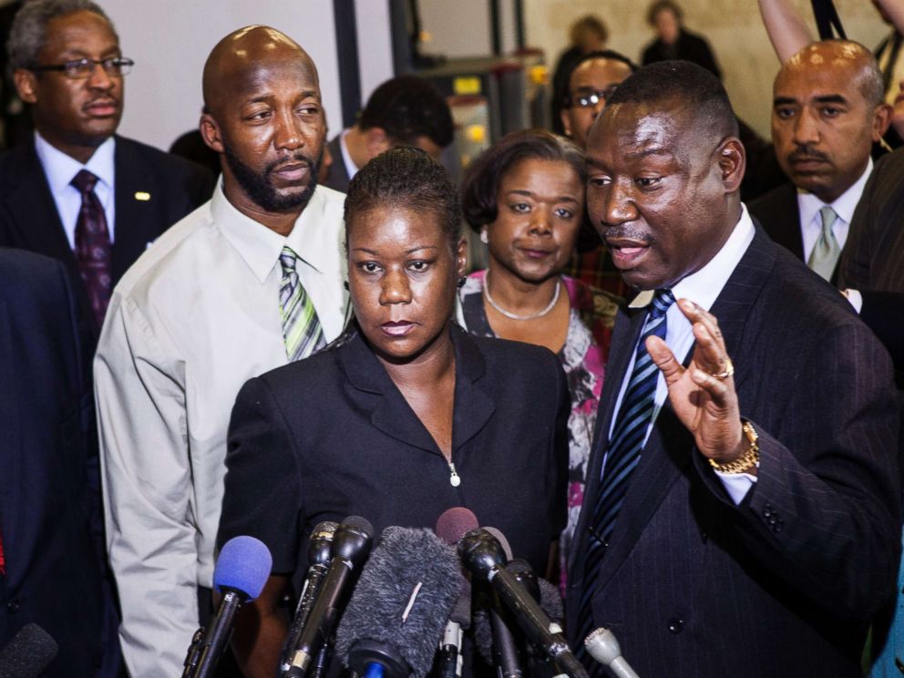 PHOTO: Sybrina Fulton (C) and Tracy Martin (L), parents of Trayvon Martin, listen while their friend and lawyer Benjamin Crump speaks to the press after a forum of Democratic members of the House Judiciary Committee on Capitol Hill March 27, 2012.