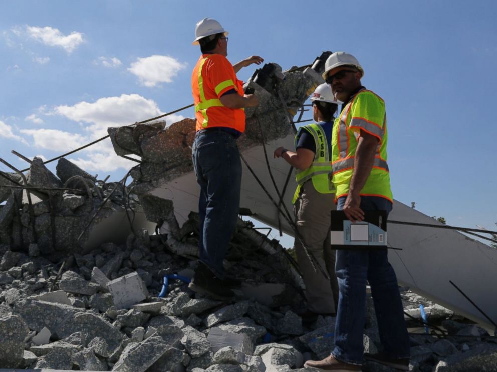 PHOTO: NTSB examine the debris from Thursdays collapse of a bridge on FIUs campus, March 16, 2018 in Miami.