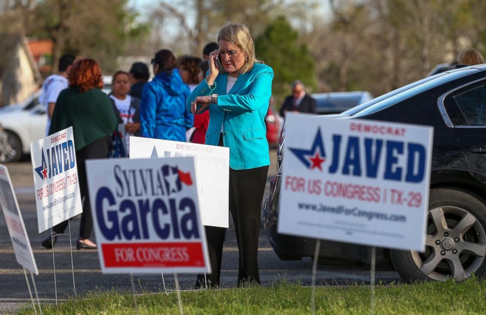 PHOTO: Senator Sylvia Garcia tries to reach officials to fix polling machines and allow constituents to vote at the Montie Beach Community Center on March 6, 2018, in Houston.