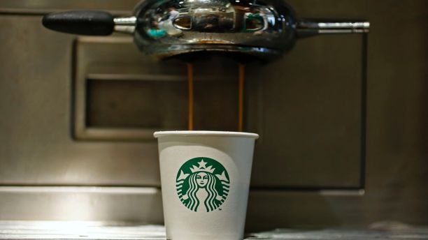 A paper cup is seen in Starbucks' Vigo Street branch in Mayfair, central London January 11, 2013.  REUTERS/Stefan Wermuth (BRITAIN - Tags: BUSINESS LOGO FOOD) - LM1E91B1ILX01