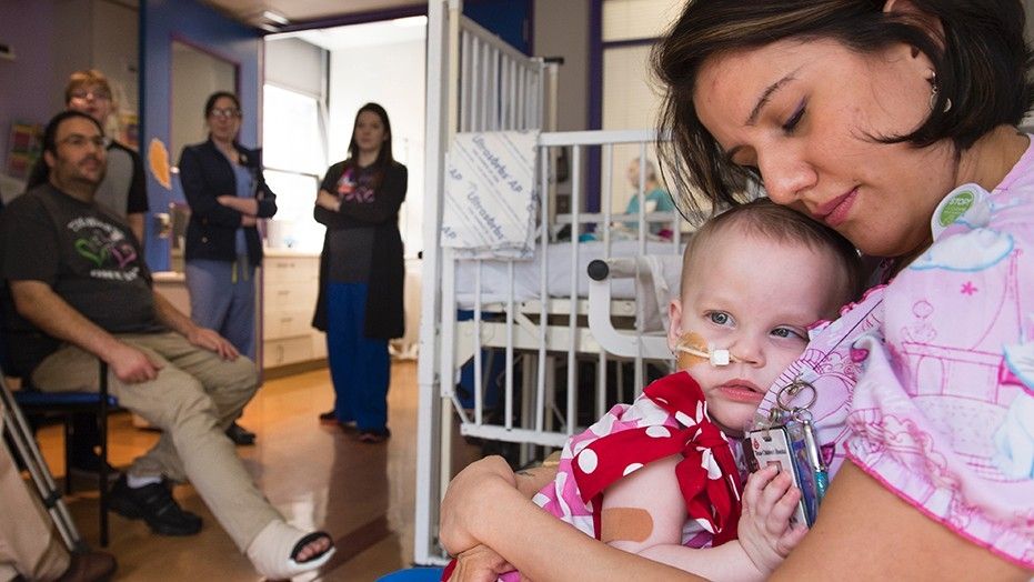 Nidia Estrada, RN, nurse at Texas Children’s Hospital, shares a moment with Anna.