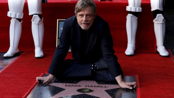 Actor Mark Hamill poses on his star after it was unveiled on the Hollywood Walk of Fame in Los Angeles, California, U.S., March 8, 2018. REUTERS/Mario Anzuoni     TPX IMAGES OF THE DAY - RC17C966C3E0