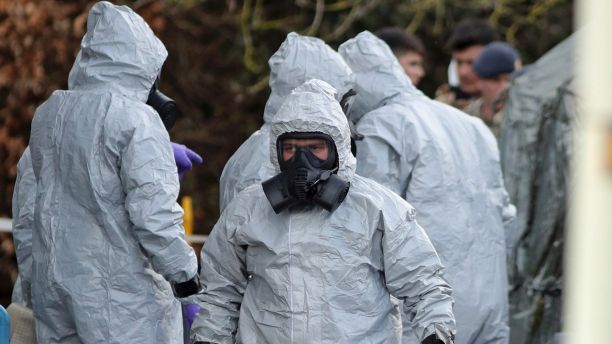 Investigators in protective clothing prepare to move an ambulance at the South Western Ambulance Service station in Harnham, near Salisbury, England, as police and members of the armed forces probe the suspected nerve agent attack on Russian spy double agent Sergei Skripal, Saturday March 10, 2018. Counter-terrorism police asked for military assistance to remove vehicles and objects from the scene in the city, much of which has been cordoned off over contamination fears of the nerve agent poisoning of former spy Sergei Skripal and his daughter. (Andrew Matthews/PA via AP)