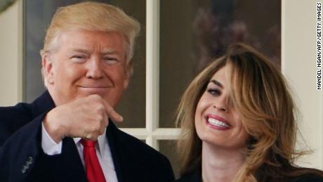 US President Donald Trump points to former communications director Hope Hicks shortly before making his way to board Marine One on the South Lawn and departing from the White House on March 29, 2018. (MANDEL NGAN/AFP/Getty Images)