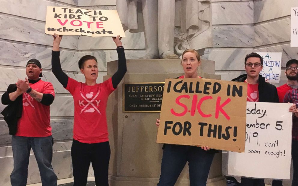 PHOTO: Whitney Walker, second left, and Tracy Kurzendoerfer protest outside of Kentucky Gov. Matt Bevins office, March 30, 2018 in Frankfort, Ky.