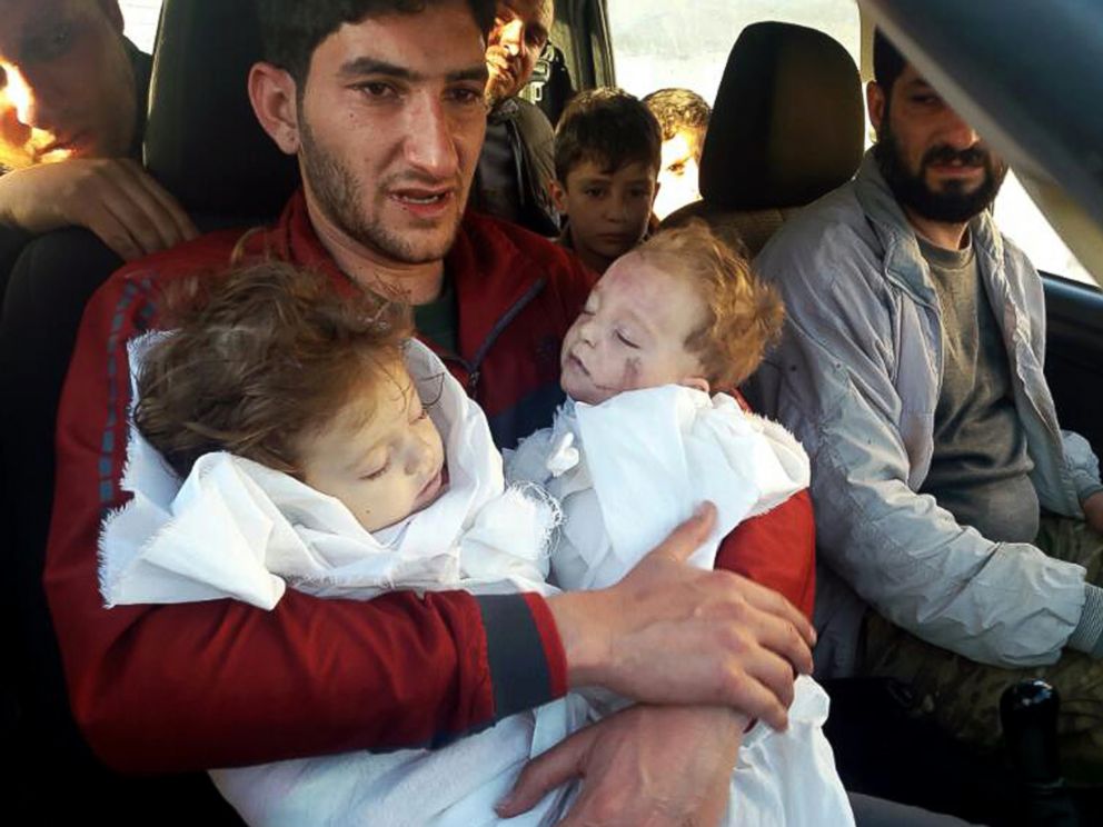 PHOTO: In this picture taken on Tuesday April 4, 2017, SAbdul-Hamid Alyousef, 29, holds his twin babies who were killed during a suspected chemical weapons attack, in Khan Sheikhoun in the northern province of Idlib, Syria.