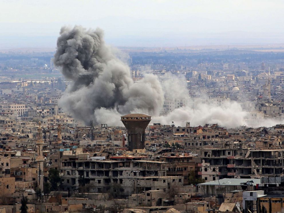 PHOTO: A general view taken from Damascus shows smoke rising from the rebel-held enclave of Eastern Ghouta following air strikes and rocket fire, Feb. 27, 2018.