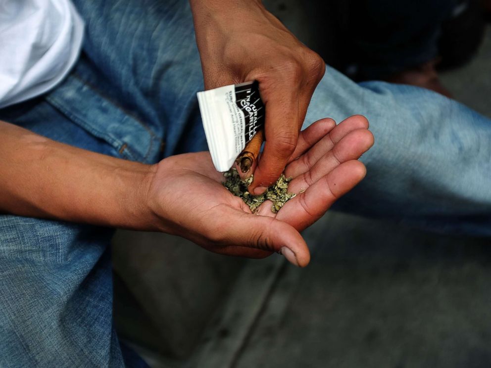 PHOTO: A man prepares to smoke K2 or Spice, a synthetic marijuana drug, in East Harlem, Aug. 5, 2015 in New York City.