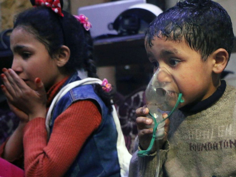 PHOTO: This image released early Sunday, April 8, 2018 by the Syrian Civil Defense White Helmets, shows a child receiving oxygen through respirators following an alleged poison gas attack in the rebel-held town of Douma, near Damascus, Syria.