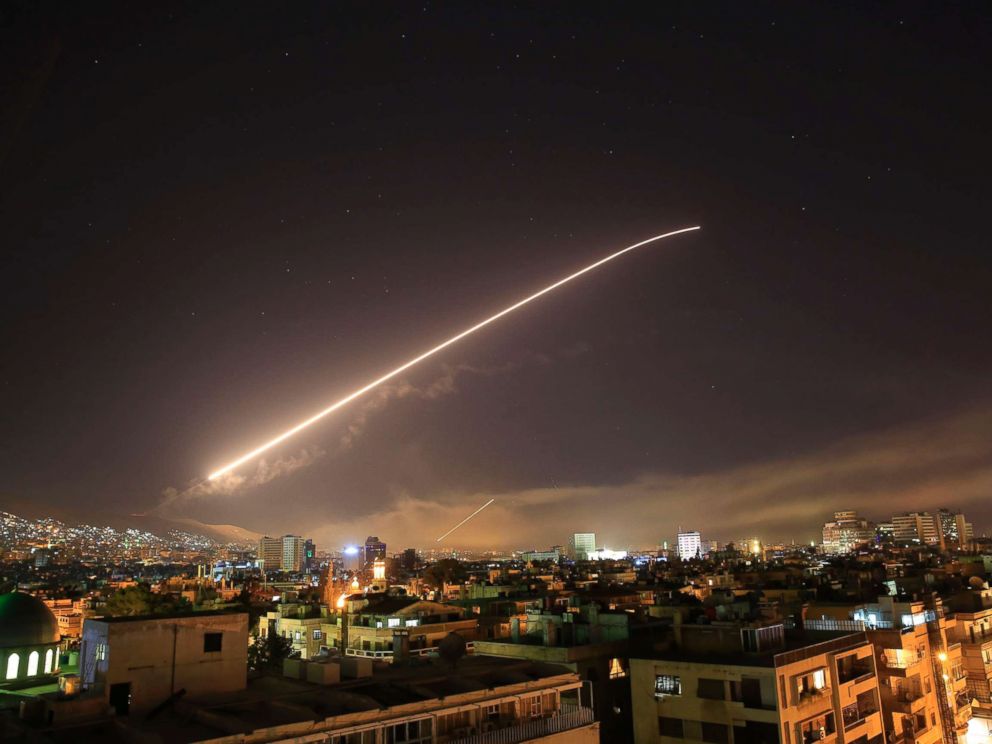 Damascus sky lights up with surface-to-air missile fire as the U.S. launches an attack on Syria targeting different parts of the Syrian capital Damascus, Syria, early Saturday, April 14, 2018.