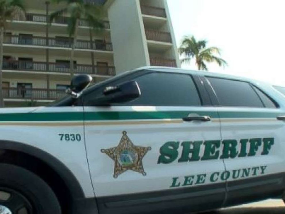 A Lee County Sheriffs Office vehicle sits outside the apartment complex in Fort Myers Beach, Fla., where Lois Hutchinson was found dead on April 9, 2018.