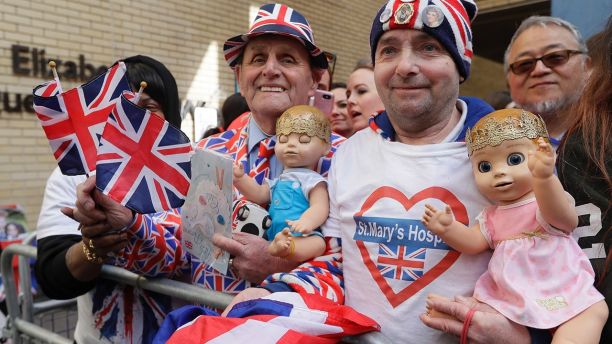 Royal fans John Loughrey, right, and Terry Hutt pose for a photo opposite the Lindo wing at St Mary's Hospital in London London, Monday, April 23, 2018.