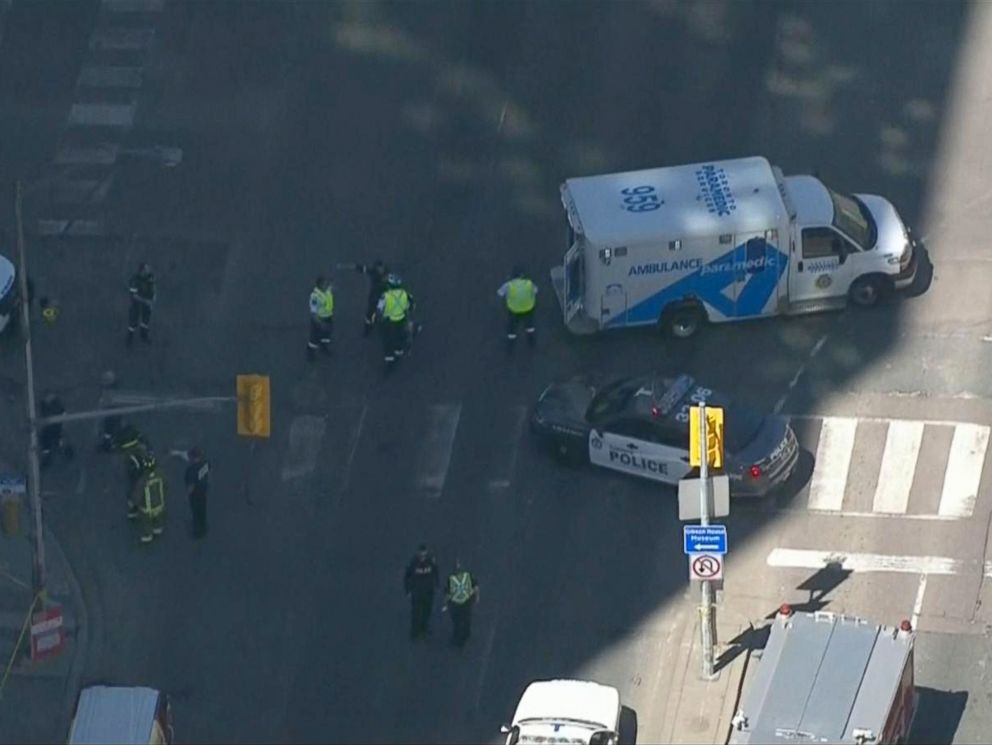 PHOTO: Police arrive on the scene where a white van struck pedestrians, April 23, 2018, in Toronto, Canada.
