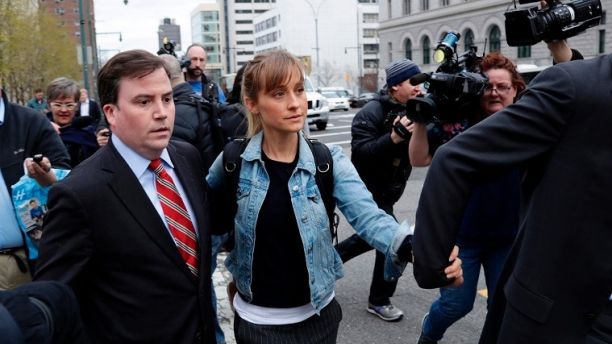 Allison Mack leaves Federal court Tuesday, April 24, 2018, in the Brooklyn borough of New York. Mack, an actress best known for playing a young Superman's friend, has been granted bail while fighting charges that she helped recruit women into a cult-like group. A federal judge in Brooklyn agreed Tuesday to release Mack on $5 million bond and place her under home detention in California. She'll be living with her parents. (AP Photo/Frank Franklin II)