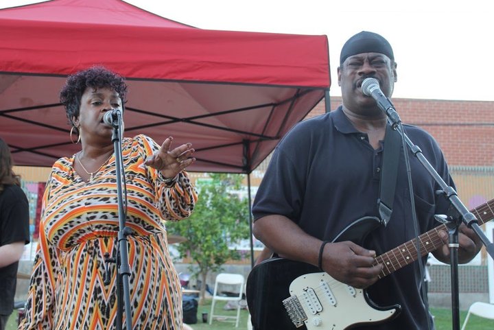 Franc&rsquo;s Melting Pot performs with singer Demetra Wilson-Washington, left, on the event stage at Gladys Park.