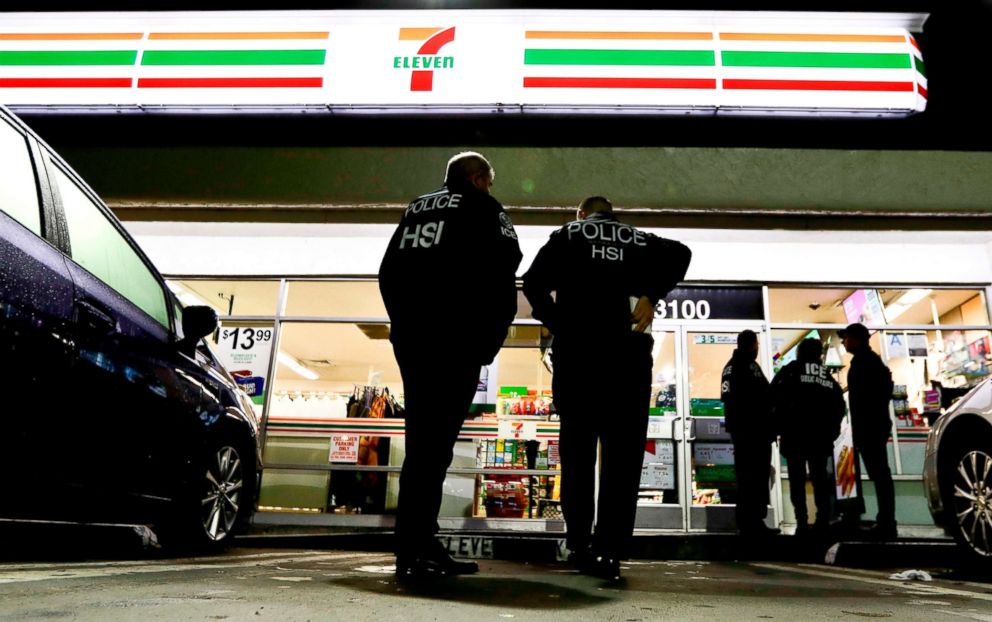 PHOTO: Immigration and Customs Enforcement agents serve an employment audit notice at a 7-Eleven convenience store in Los Angeles, Jan. 10, 2018.