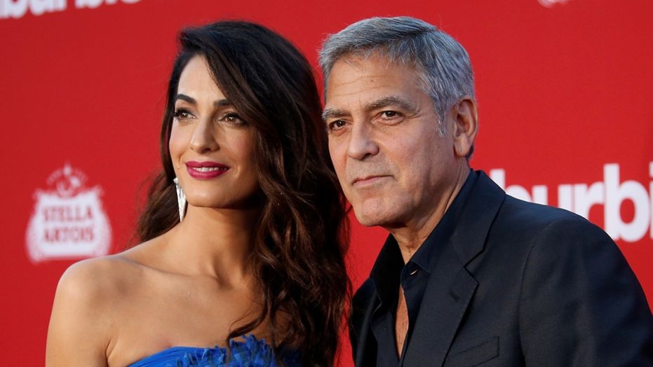 Director George Clooney and his wife Amal attend the premiere for "Suburbicon" in Los Angeles, California, U.S., October 22, 2017. REUTERS/Mario Anzuoni - RC169B919000