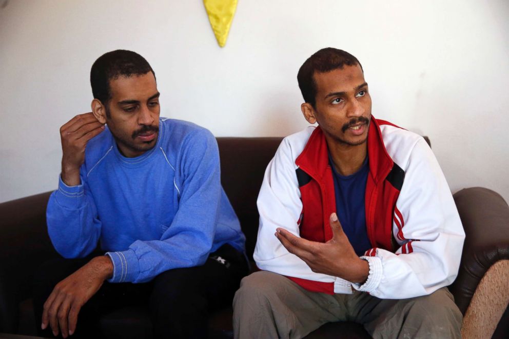 PHOTO: Alexanda Amon Kotey, left, and El Shafee Elsheikh, who were allegedly among four British jihadis who made up a brutal Islamic State cell dubbed The Beatles, speak during an interview at a security center in Kobani, Syria, March 30, 2018.