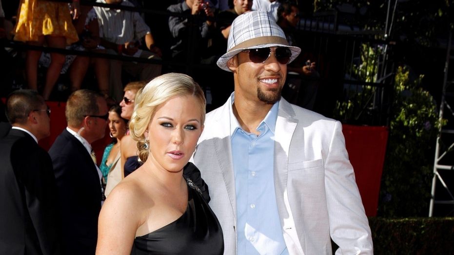 Kendra Wilkinson and Hank Baskett pose together in a 2009 photo. Wilkinson hinted she and Baskett are divorcing. 