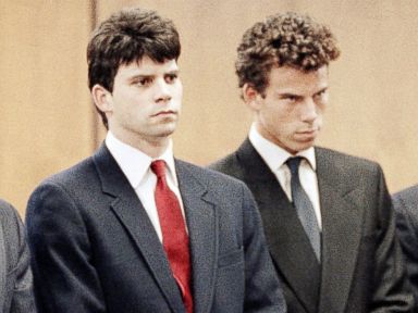PHOTO: Lyle Menendez, second from left, and his brother, Erik, second from right, are flanked by their attorneys as the brothers delayed entering pleas through their attorneys in Beverly Hills Municipal Court, March 13, 1990.