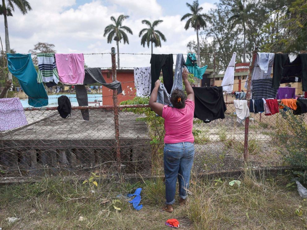 PHOTO: A Central American migrant taking part in a caravan called Migrant Via Crucis towards the U.S. hangs clothes to dry at a sports field in Matias Romero, Oaxaca State, Mexico, April 3, 2018.