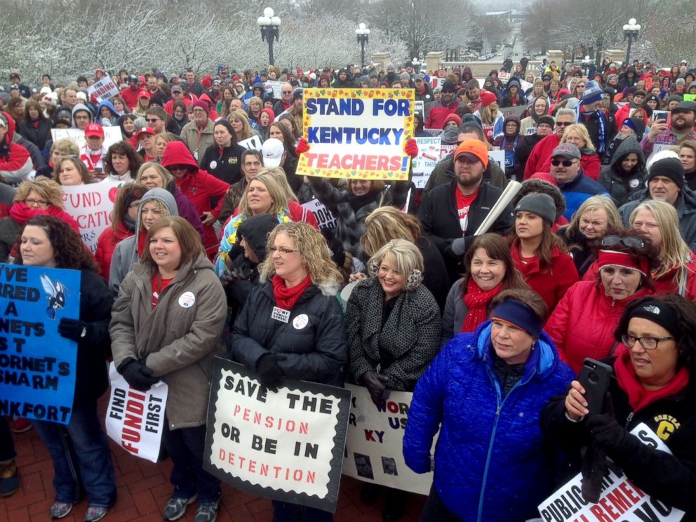 PHOTO: Teachers and other school workers rally against a proposed pension overhaul bill outside the state Capitol, March 21, 2018, in Frankfort, Ky.