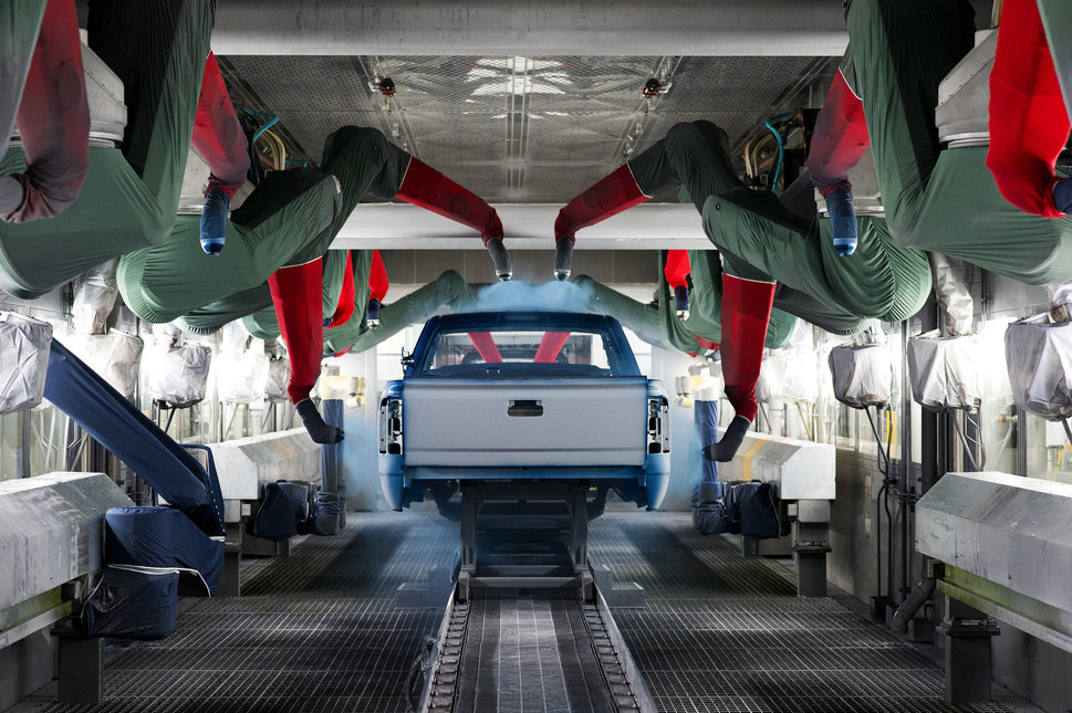 Machinery sprays paint on a pickup truck at GM&rsquo;s assembly facility in Flint, March 23.&nbsp;The base coat is applied by