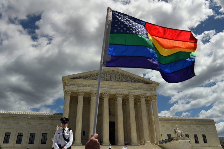 &nbsp;A supporter of gay marriage waves his rainbow flag in front of the U.S. Supreme Court in Washington, D.C., April 28, 20