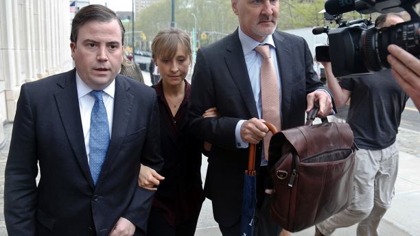 Actress Allison Mack, center, arrives with her legal team to Brooklyn Federal Court, Friday May 4, 2018, in New York.