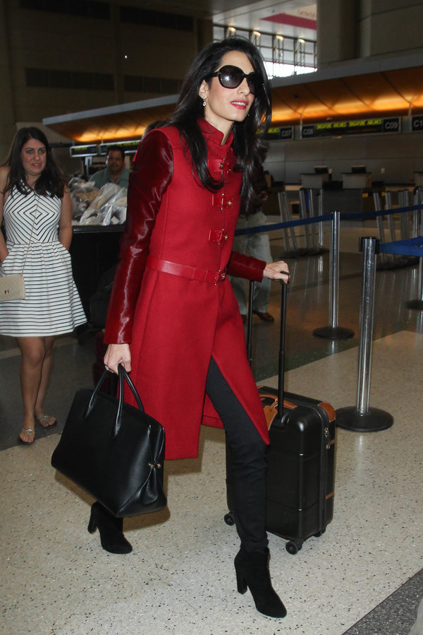Leave it to Clooney to look this polished at the airport. She was spotted wearing this red Versace coat at Los Angeles Intern