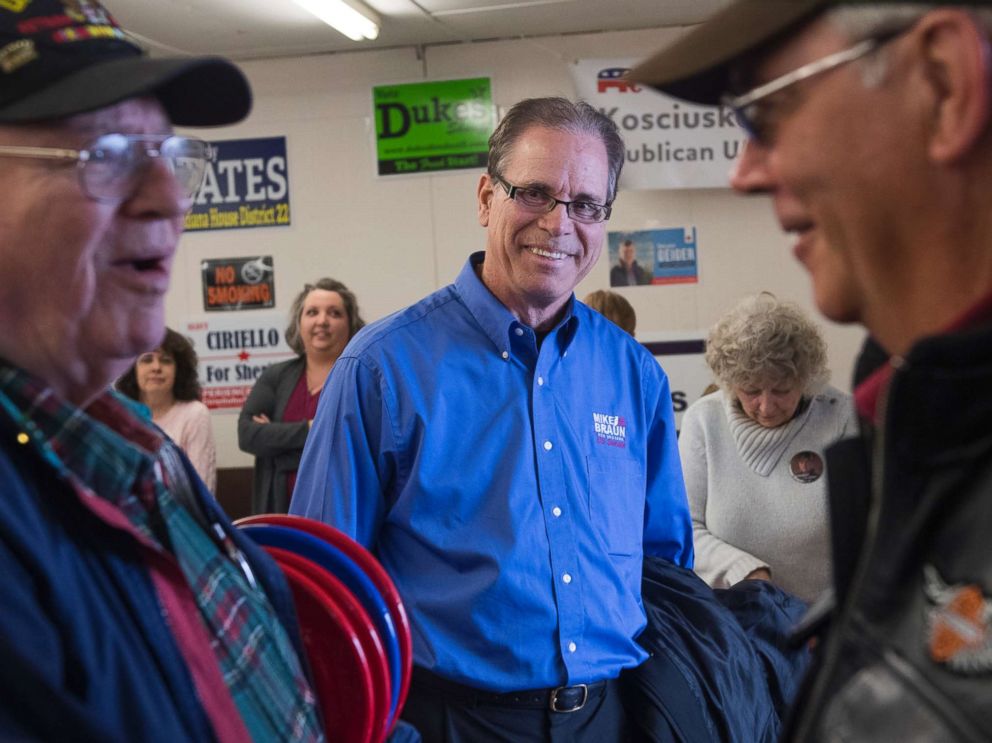 PHOTO: Mike Braun, center, candidate for the Republican nomination for Senate in Indiana, attends the Kosciusko County Republican Fish Fry in Warsaw, Ind., April 4, 2018.