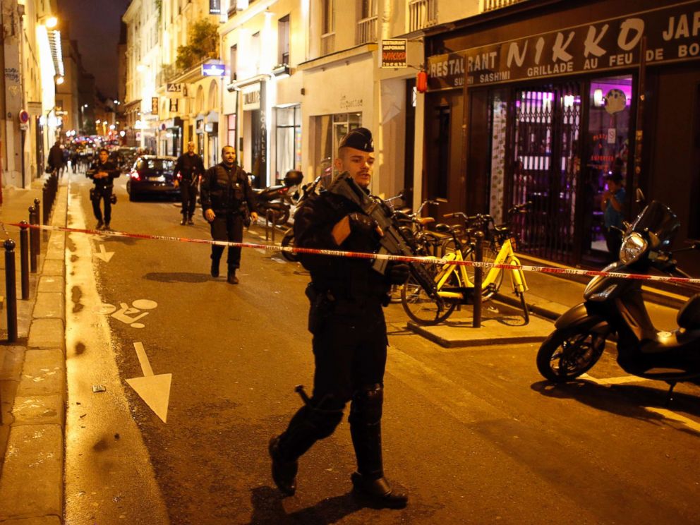 PHOTO: A police officer cordons off the area after a knife attack in central Paris, May 12, 2018.