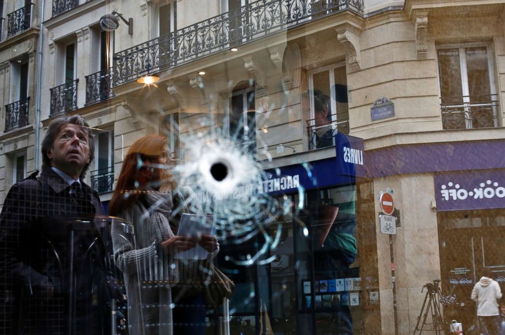 PHOTO: A bullet hole seen on the window of a cafe located near the area where the assailant of a knife attack was shot dead by police officers, in central Paris, May 13, 2018.