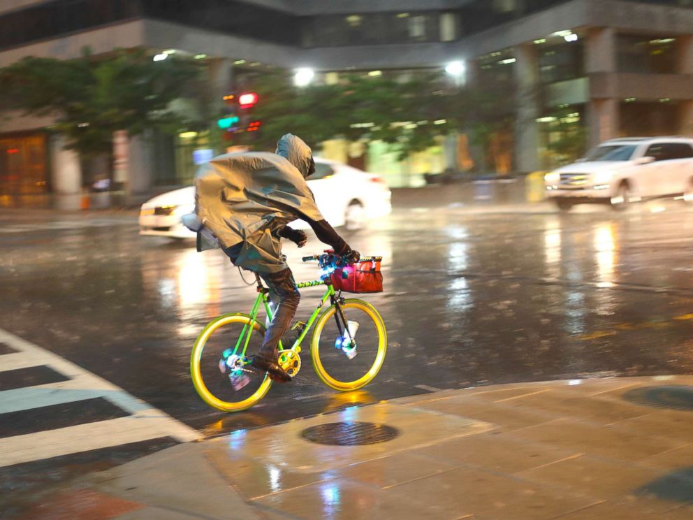 PHOTO: A bicyclist rides is heavy rainfall in downtown Washington, May 14, 2018.