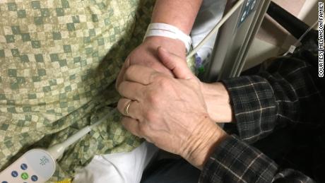 Steve Melanson holds his wife&#39;s hand while she was hospitalized after the Las Vegas shooting.