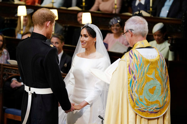 Prince Harry and Meghan Markle in St George's Chapel at Windsor Castle during their wedding service, conducted by the Archbis