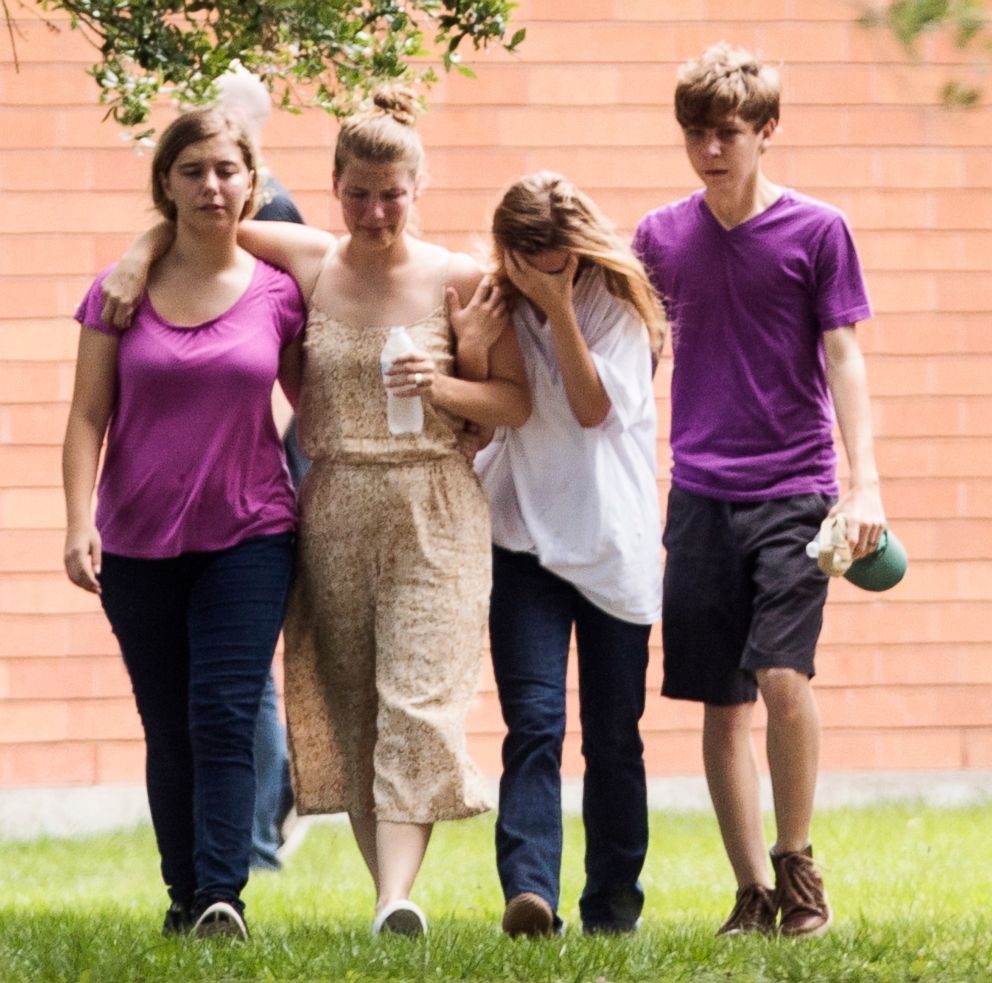 PHOTO: Students gather by the Barnett Intermediate School where parents are gathering to pick up their children following a shooting at Santa Fe High School, May 18, 2018, in Santa Fe, Texas.