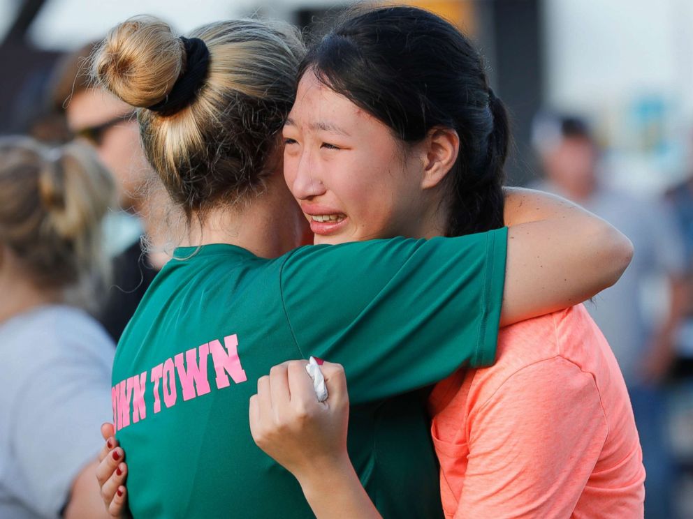 PHOTO: Friends and family attend a vigil held at the First Bank in Santa Fe for the victims of a shooting incident at Santa Fe High School, May 18, 2018 in Santa Fe, Texas.